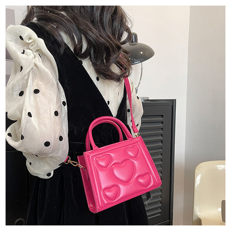 1pc Women’s Stylish Solid Color Handbag with Detachable Strap – Heart Pattern Design, Perfect for Valentine’s Day Gift, Available in Magenta, White, Black, Green, Yellow